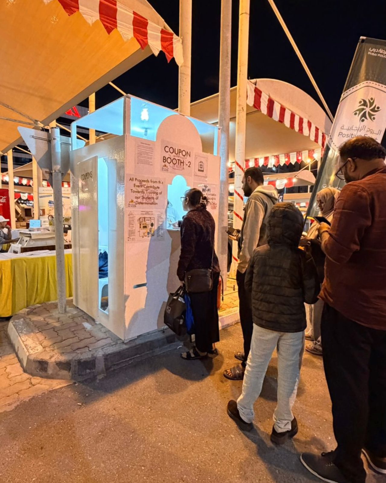 Visitors queueing at a booth during the funfair