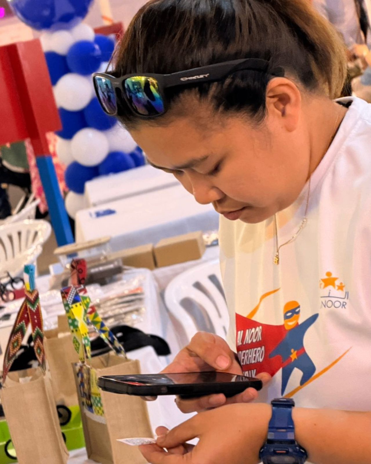 Staff member scanning a code at the booth